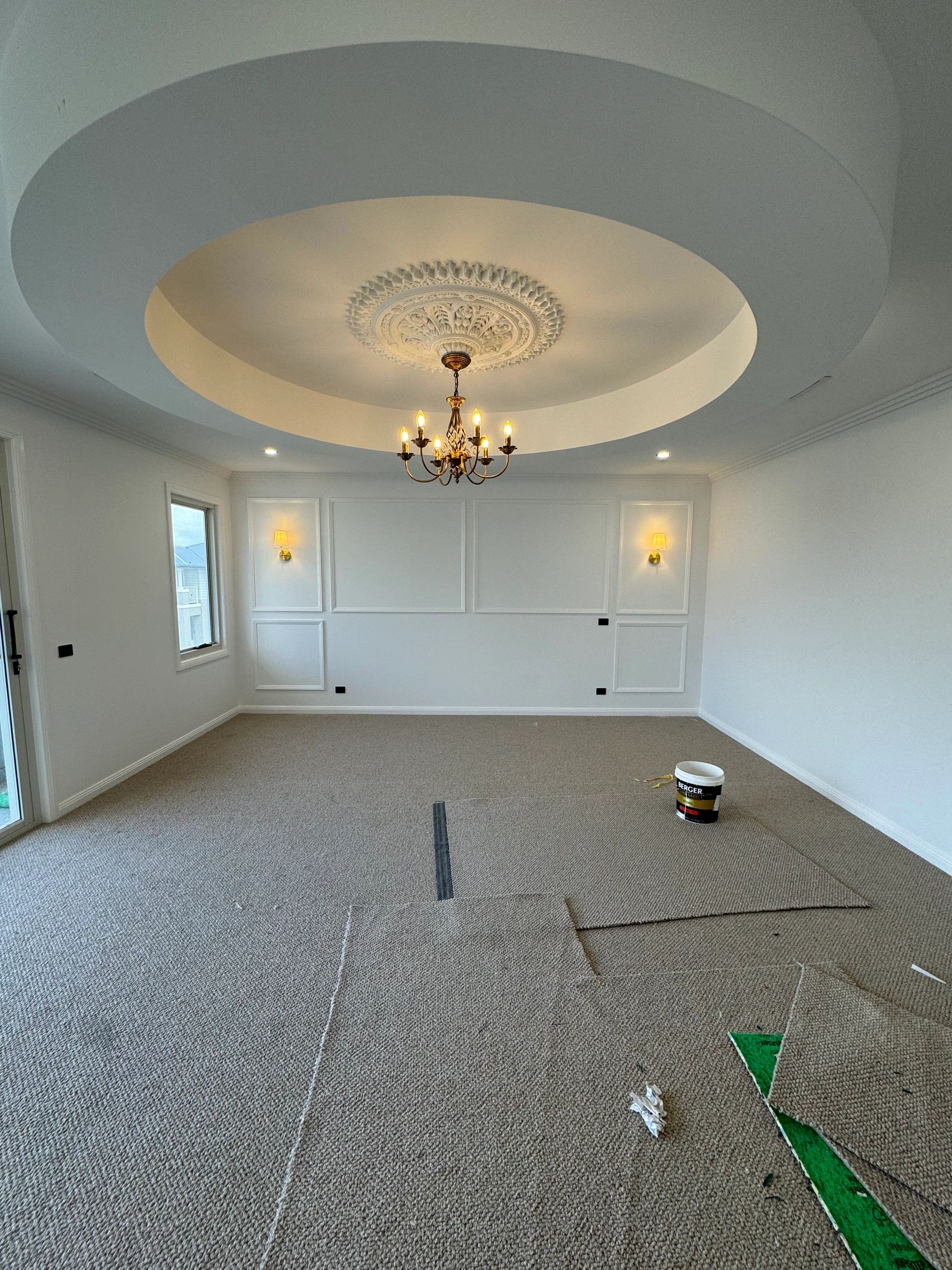Elegant interior with coffered ceiling and bronze chandelier