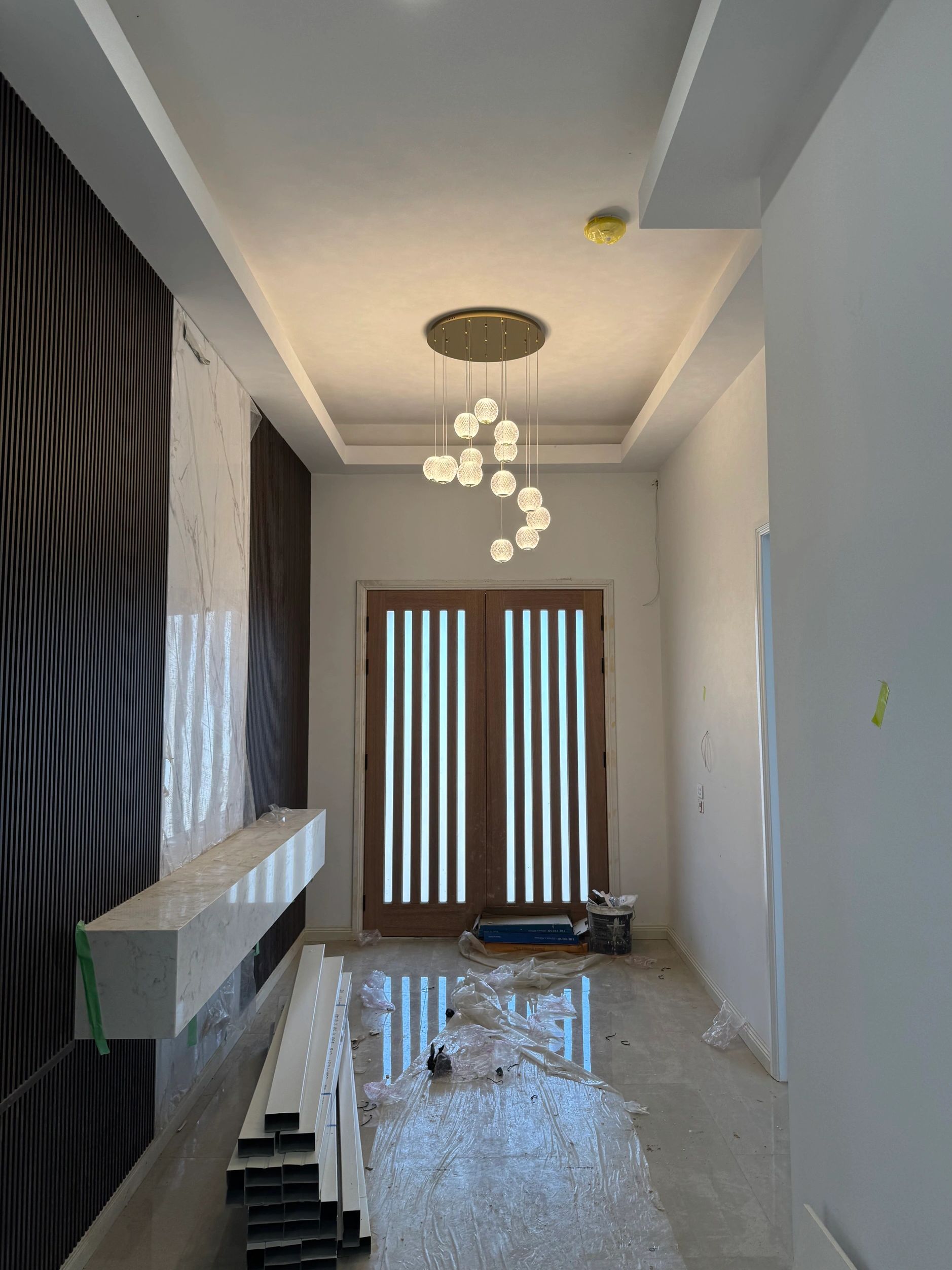 Interior hallway with cascading pendant light